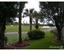 VIEW TO THE RIGTH OF THE COVERED PORCH. ANOTHE LAKE!!!...MORE GOLF VIEWS.. A MUST SEE. : property For Sale image