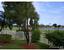 LEFT SIDE OF PATIO VIEW. NOTICE THE LARGE LAKE AND THE GOLF COURSE. : property For Sale image