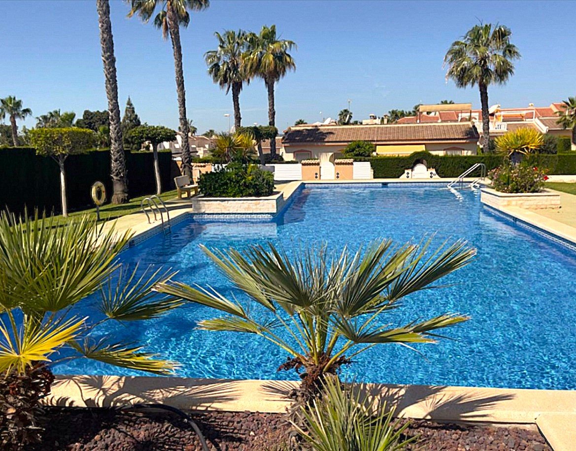 Photo 4 of Bungalow with rooftop solarium in gated community with garden and pool!
