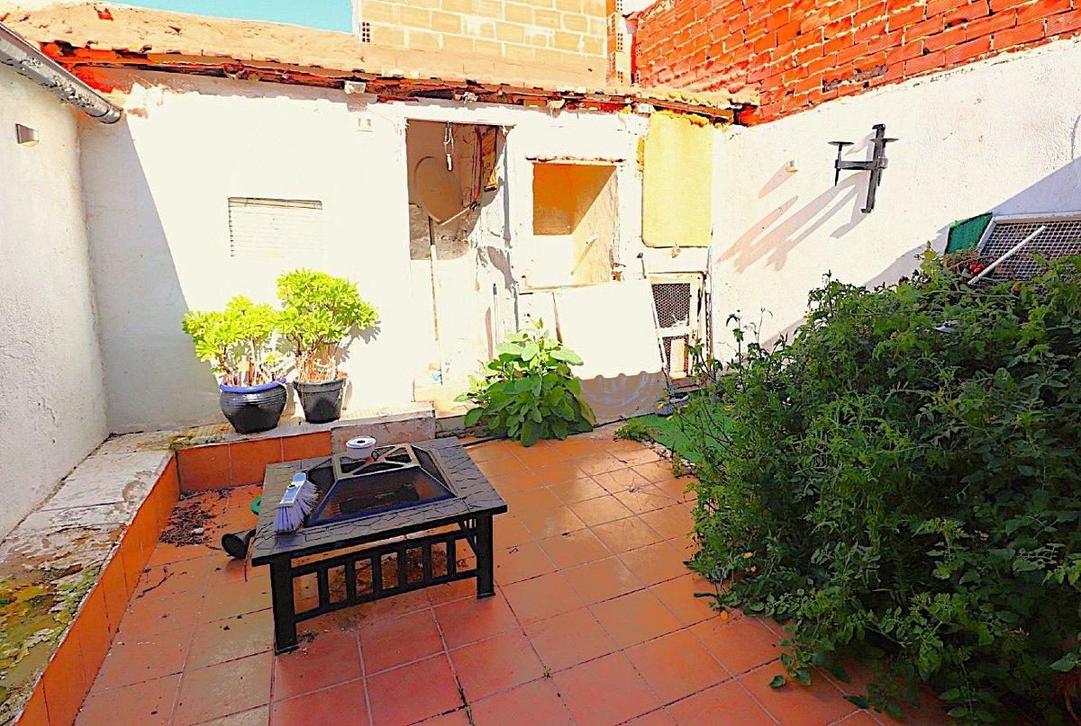 Photo 3 of DIY project. South-facing bungalow with open fireplace and rear courtyard!