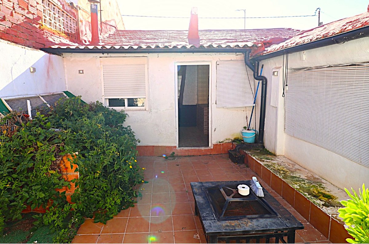 Photo 4 of DIY project. South-facing bungalow with open fireplace and rear courtyard!
